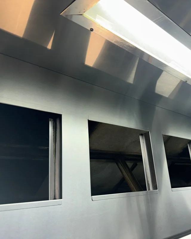 The same canopy interior degreased back to bare stainless steel after cleaning