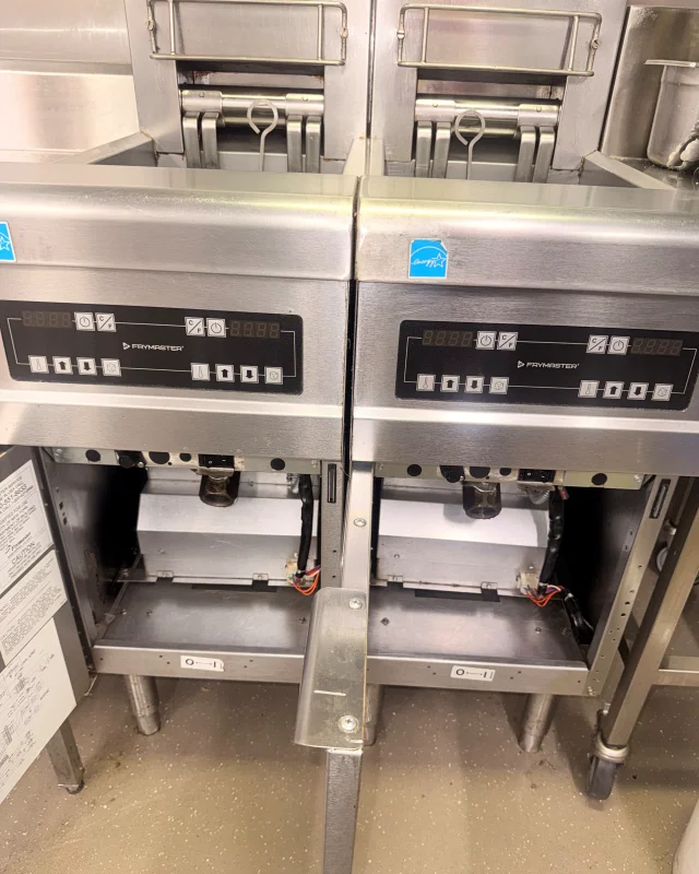 The same two fryers with their panels, surrounds and cabinet floors degreased back to clean stainless steel